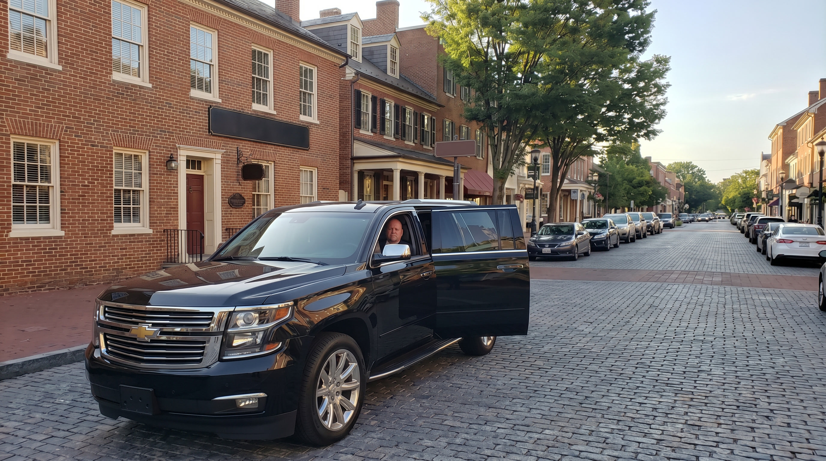 5-Star Executive Chauffeuring black Suburban on a historic Winchester street